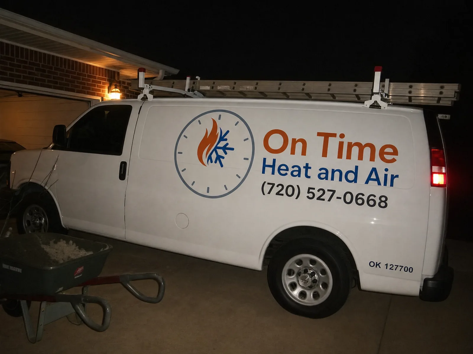 On Time Heat and Air service van at commercial building Denver night
